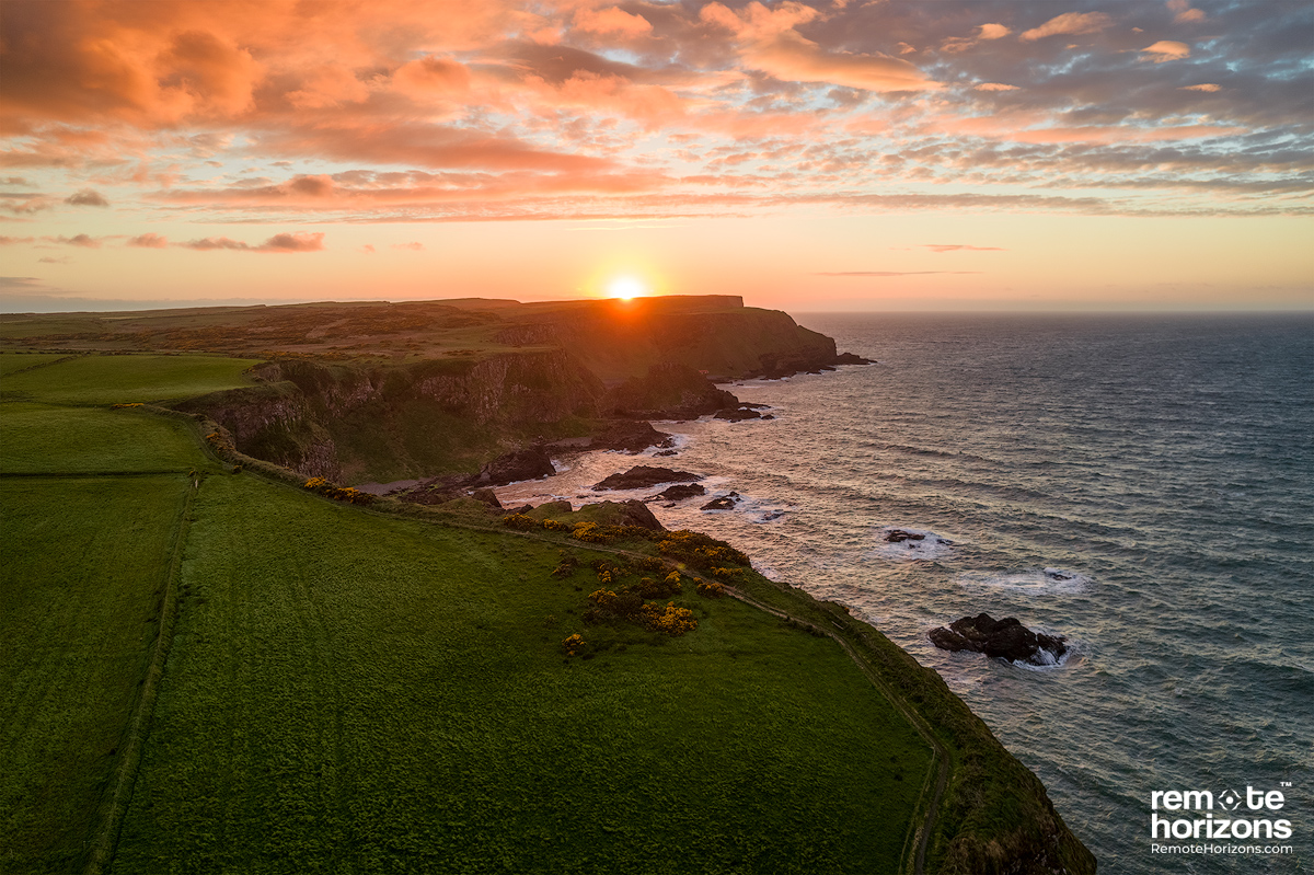 Northern Ireland aerial landscape photography showing the Causeway cliff walk at sunset.