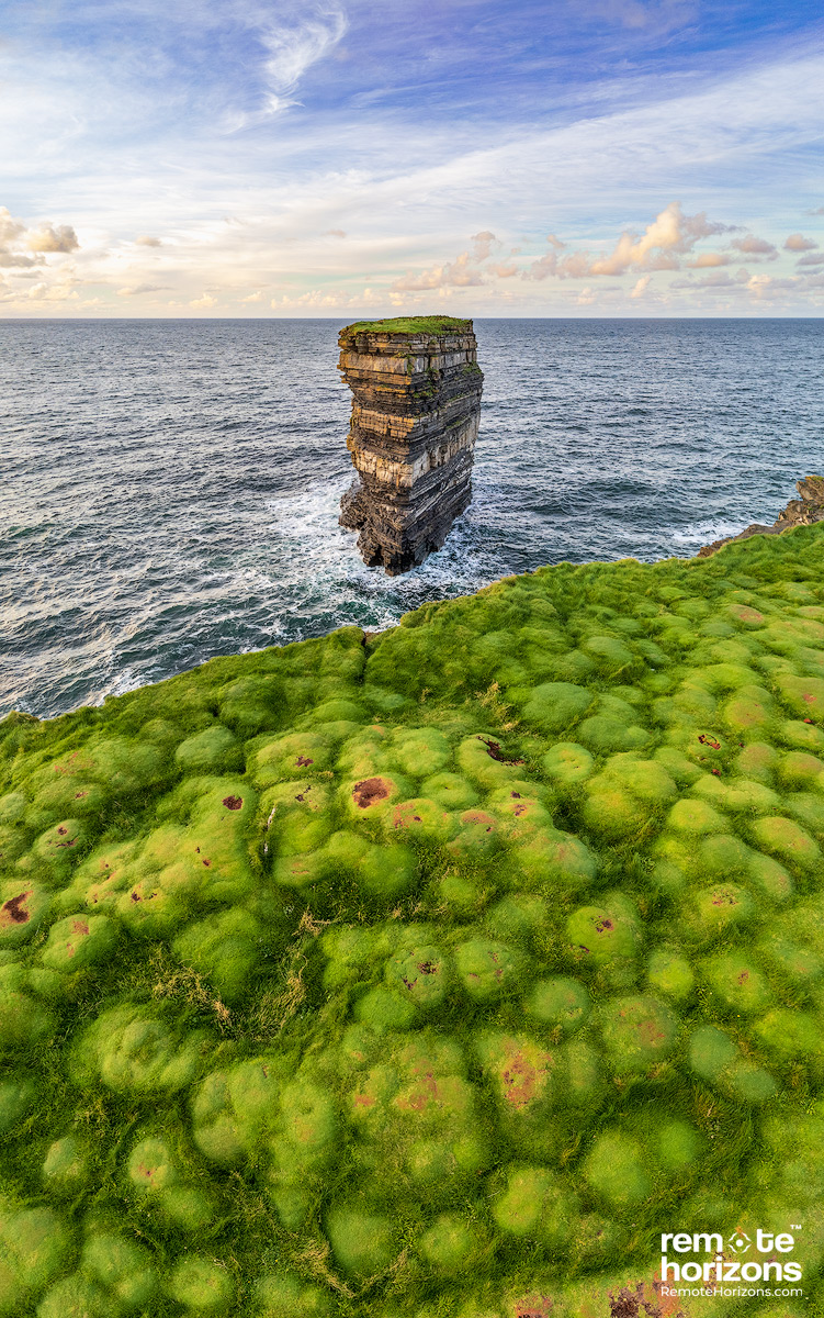 Aerial landscape photograph of Dun Briste sea-stack, Downpatrick Head, County Mayo, Ireland.  This shows the unique dimpled landscape at the cliff edge.