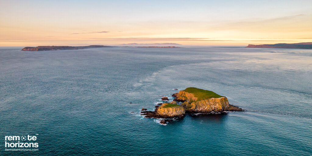 Northern Ireland aerial landscape photography of Sheep Island with Fairhead, Rathlin Island and Scotland in the background