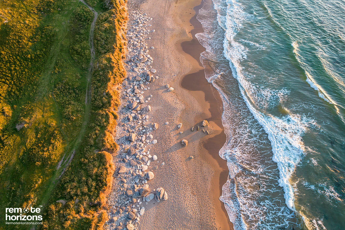 Northern Ireland aerial landscape photograph of White Park Bay at sunset.