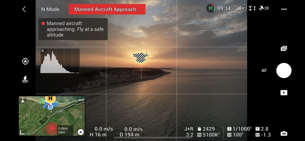DJI Fly app showing Manned Aircraft Approaching warning with DJI Airsense for landscape photography