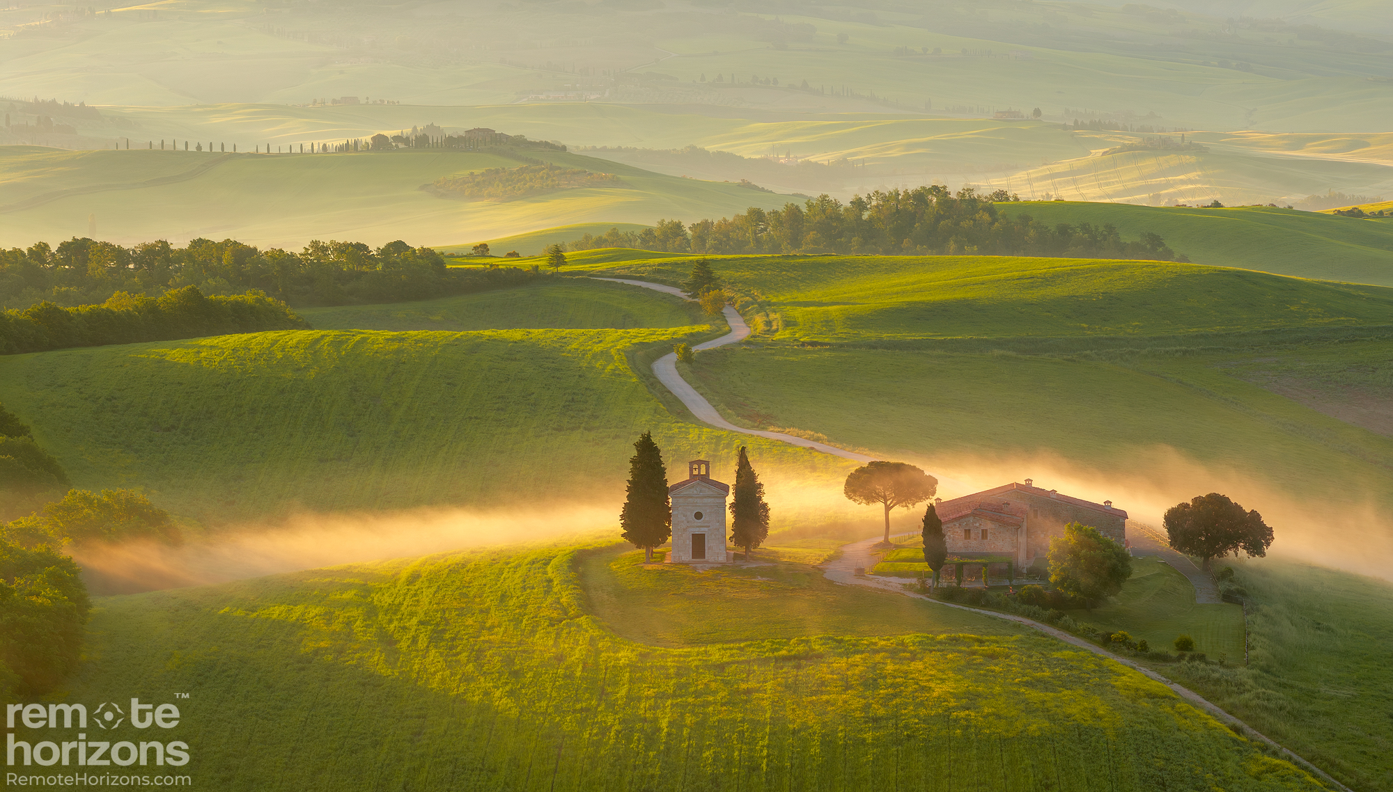 DJI Mavic 3 Pro aerial landscape photograph of Chapel Vitaleta in Val d’Orcia, Tuscany, surrounded by cypress trees and golden hour fields